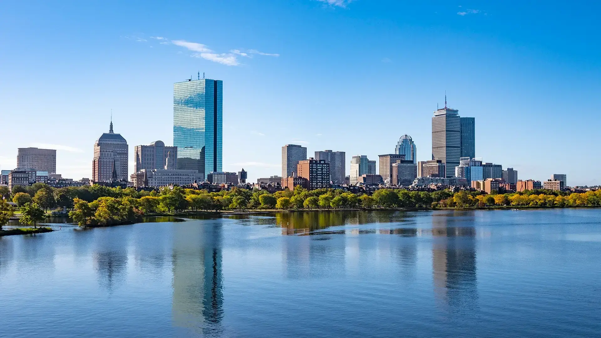 Wide-angle view of the Boston city skyline at sunset, representing Fortitude’s local expertise and industry insights.